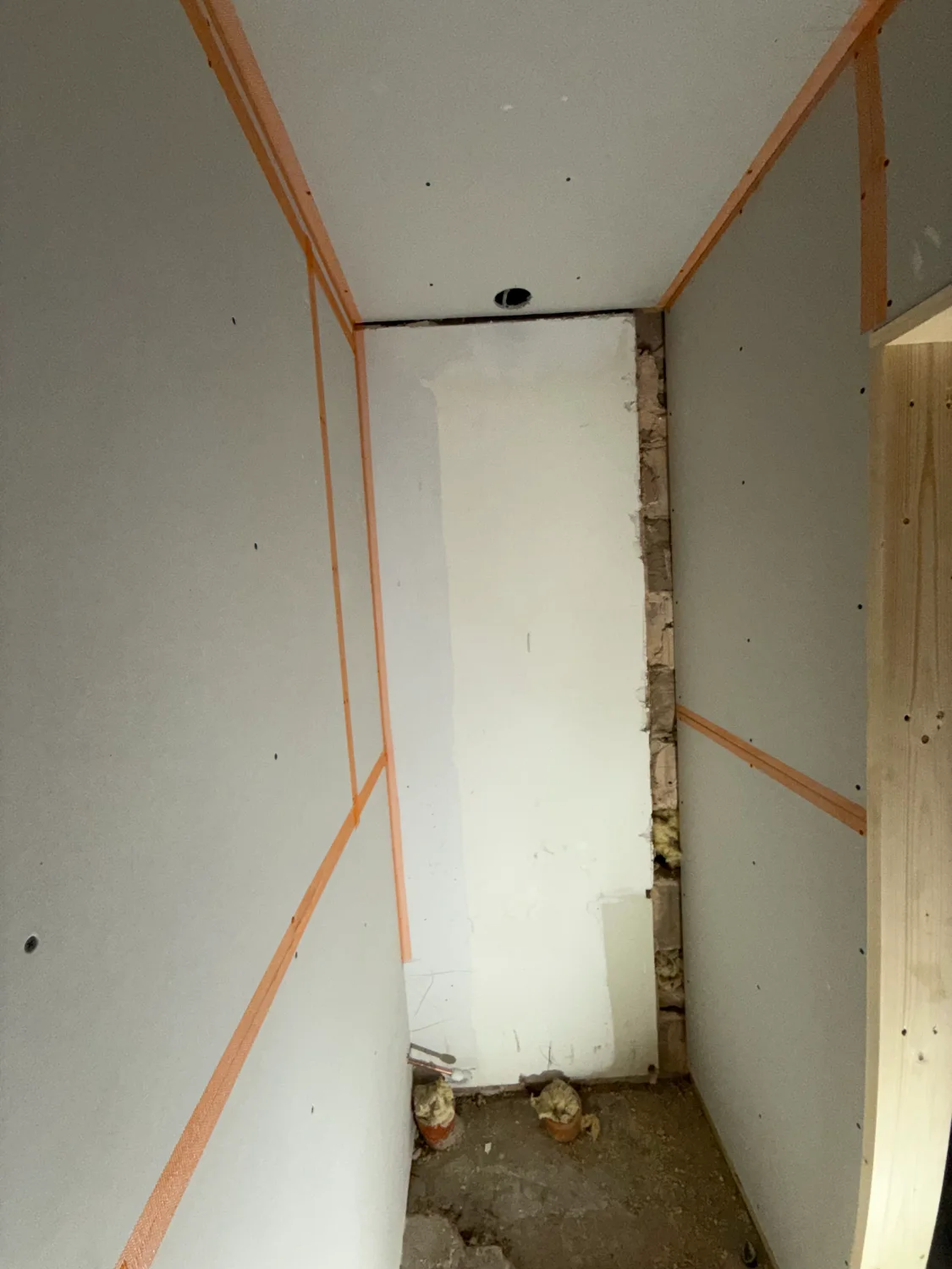 A small room boarded out and taped at every joint, ready for skimming
