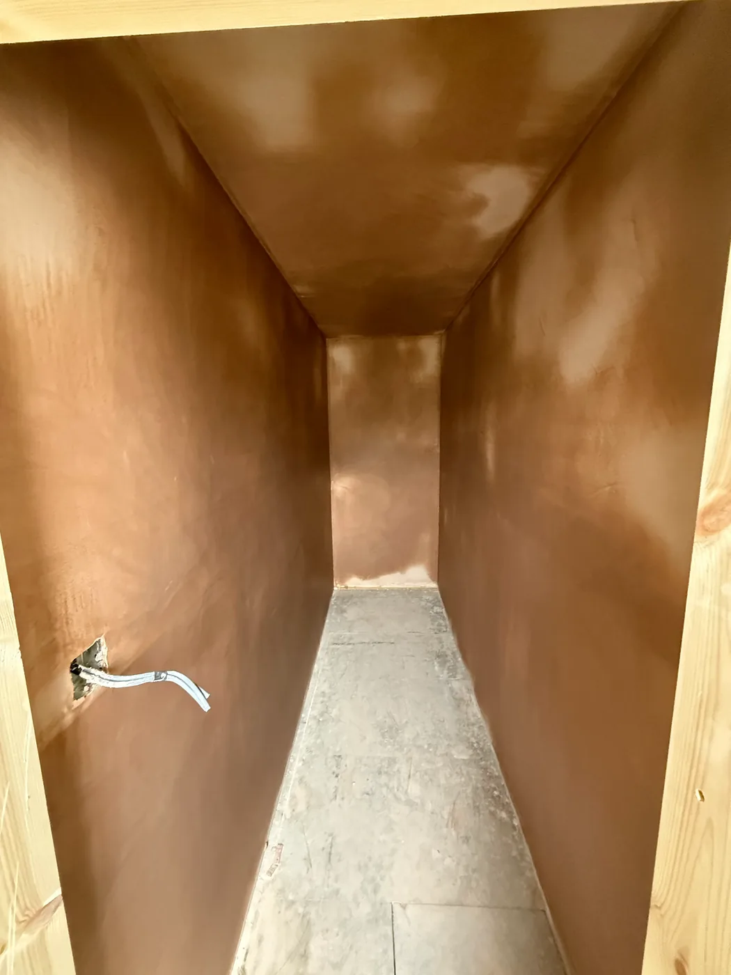 A corridor overboarded and skimmed, walls and ceiling in one finish