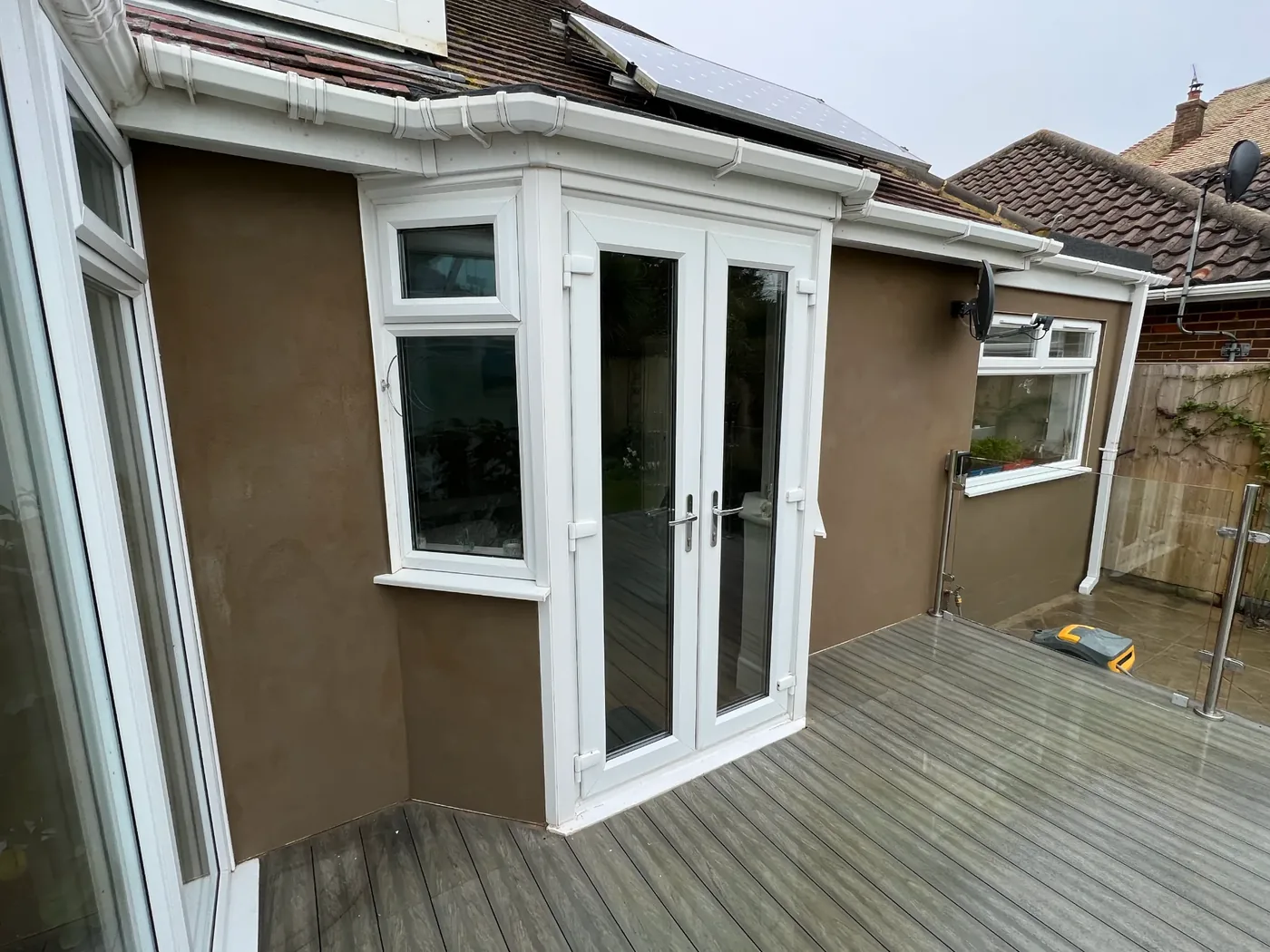 The same wall finished in sand and cement render