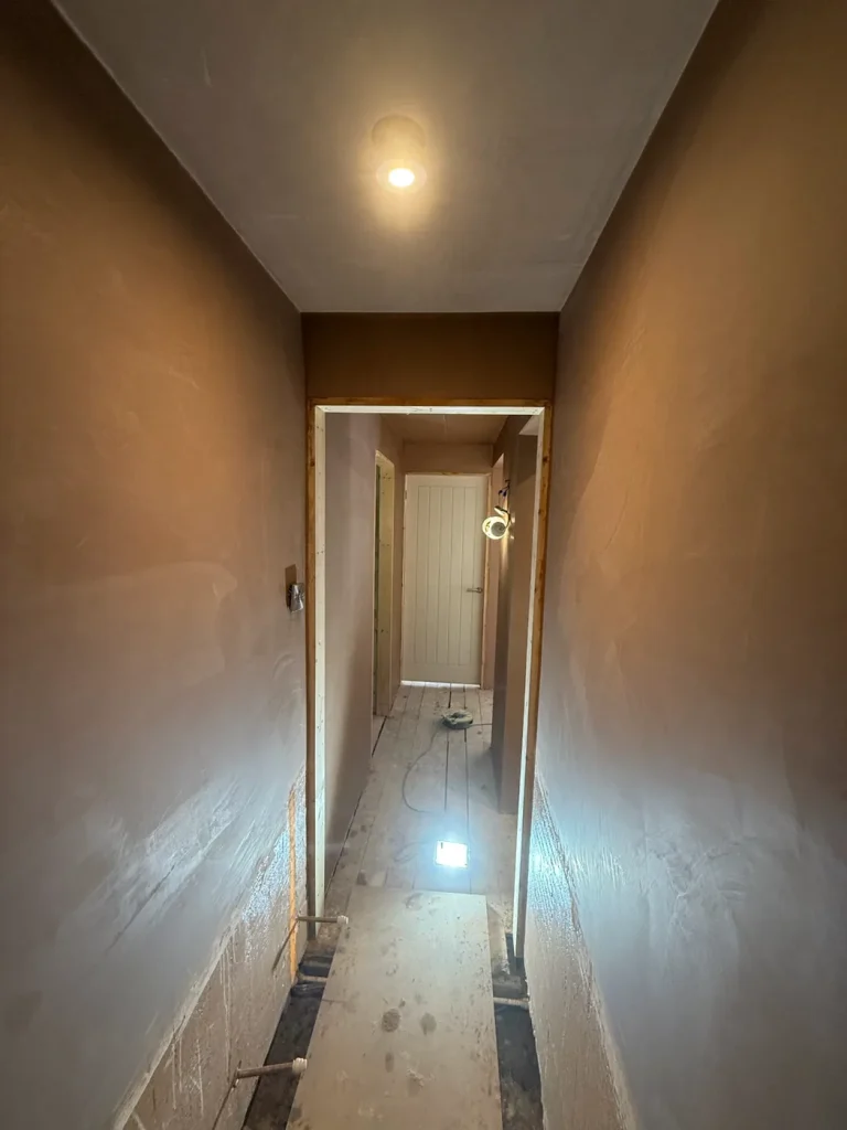 A hall, stairs and landing skimmed throughout