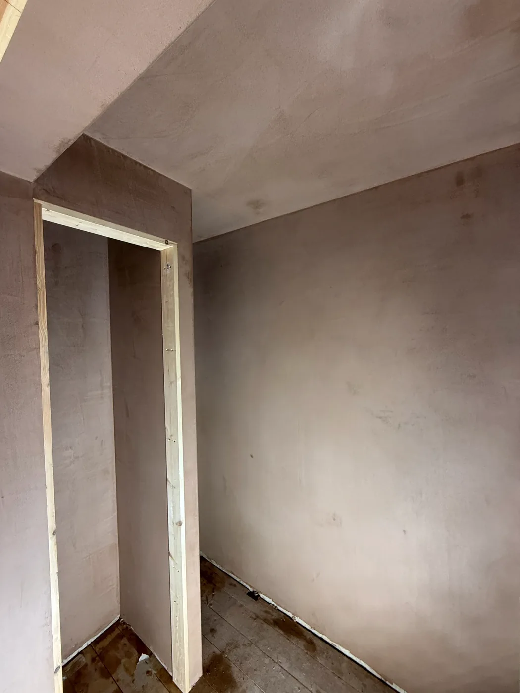 The same room skimmed, with the walls and ceiling flat and the door opening framed out